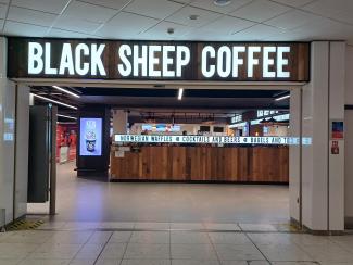 Wait at the Norwegian Waffles sign of Black Sheep Coffee