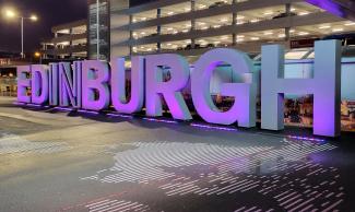 Edinburgh Airport sign at night